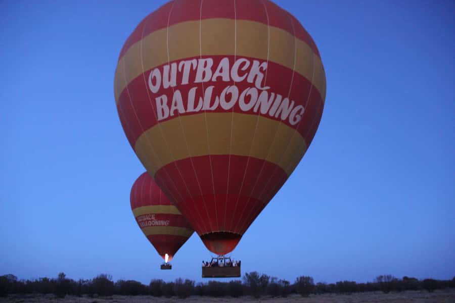 Alice Springs: Early Morning Hot Air Balloon Flight - Landing, packing, and the bush celebration