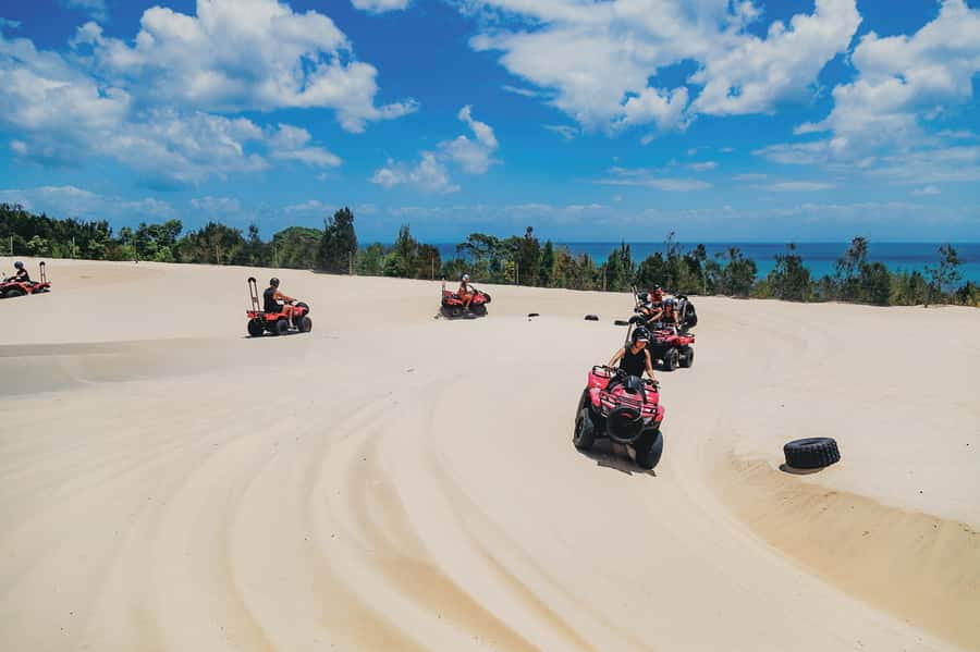 Moreton Island: Tangalooma ATV Quad Bike & Dolphin Feeding - Sunset and the boat home close a long day