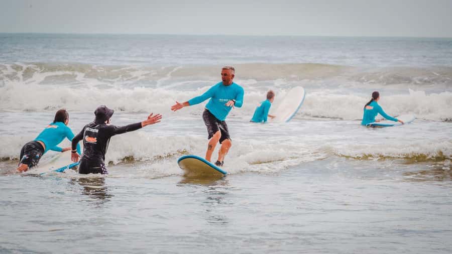 Noosa Heads: 2 Hour Surf Experience on the Sunshine Coast - Getting waist-deep into the surf